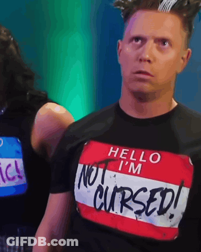 Man In Shirt Saying Hello I'm Not Cursed GIF