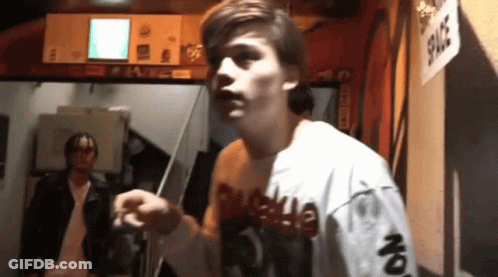 Man In Shirt Saying Supreme On Sleeves GIF