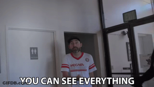 Man In Shirt Saying You Can See Everything In Hallway GIF