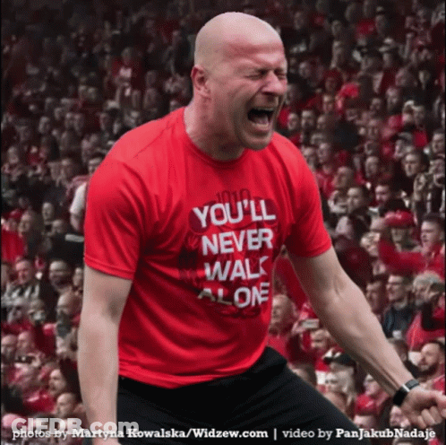 Man In Shirt Saying You'll Never Walk Alone GIF