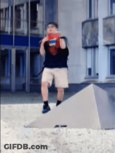 Man In Shorts And Backpack On Concrete Ramp GIF