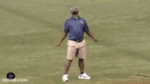 Man In Shorts And Sunglasses On Baseball Field GIF