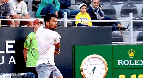 Man In Sit La Shirt Standing Next To Another Man GIF