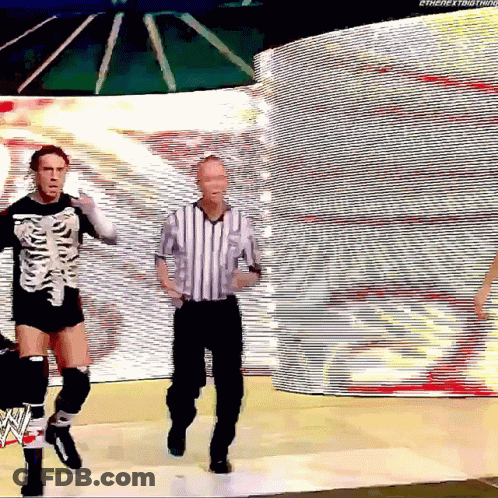 Man In Skeleton Costume Dancing With Referee GIF
