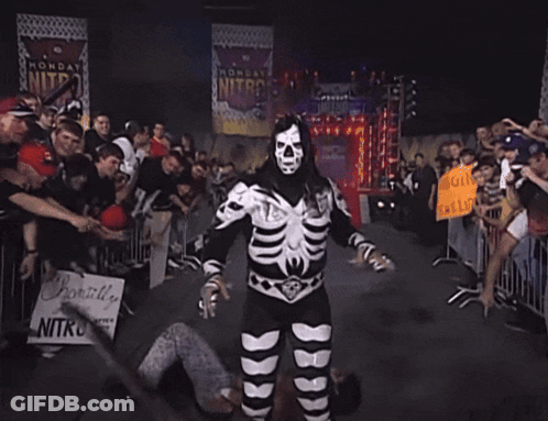 Man In Skeleton Costume Holding Sign Probably Live Nitro GIF