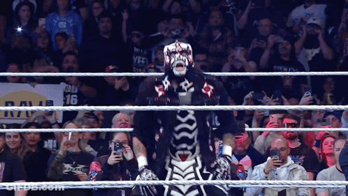 Man In Skeleton Costume With Raw 16 Sign GIF