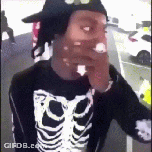 Man In Skeleton Sweater And Hat Smoking Cigarette GIF
