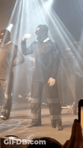 Man In Ski Mask Dancing On Stage GIF