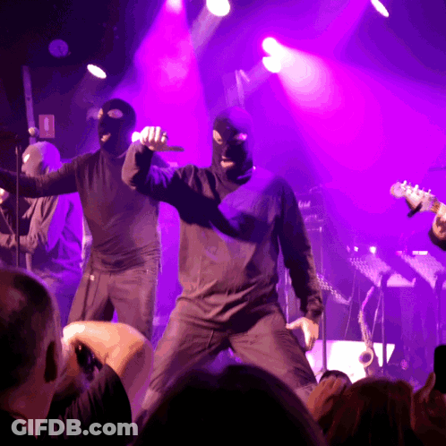 Man In Ski Mask Singing Into Microphone GIF