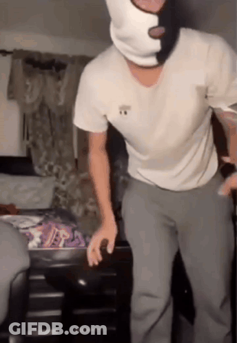 Man In Ski Mask Standing In Bedroom GIF