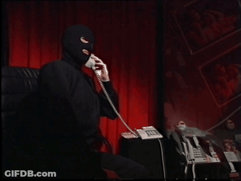 Man In Ski Mask Talking On Phone GIF
