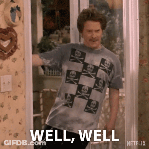 Man In Skull And Crossbones T-Shirt In Doorway GIF