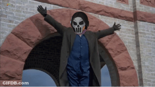 Man In Skull Mask And Headphones In Brick Archway GIF