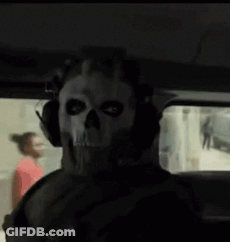 Man In Skull Mask And Headphones Sitting In Car GIF