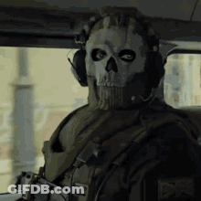 Man In Skull Mask Sitting In Car With Headphones GIF