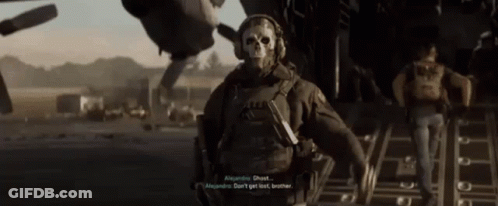 Man In Skull Mask Talking To Another Man GIF
