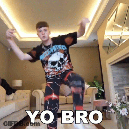 Man In Skull Shirt Dancing In Front Of Couch Saying Yo Bro GIF