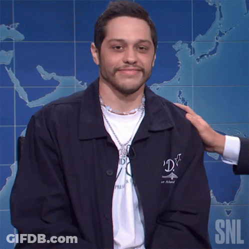 Man In SNL Jacket Patted On Shoulder GIF