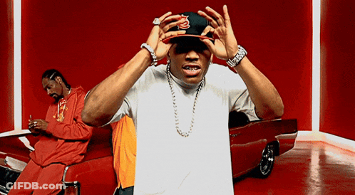 Man In Snoop Dogg Hat Standing By Red Car GIF