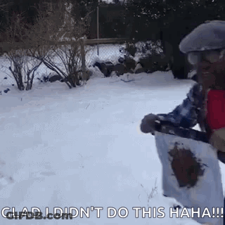 Man In Snow Holding Shovel And Paper GIF