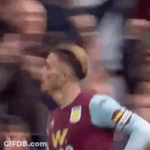 Man In Soccer Uniform Facing Crowd GIF