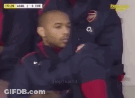 Man In Soccer Uniform Sitting In Stands GIF