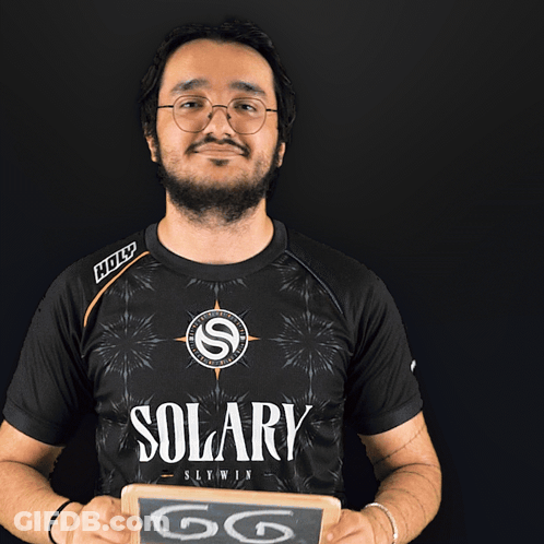 Man In Solary Shirt Holding Chalkboard Saying GG GIF