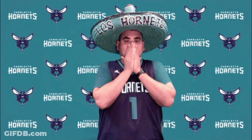 Man In Sombrero In Front Of Charlotte Hornets Backdrop GIF