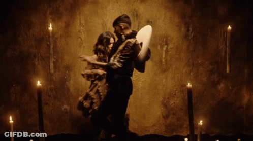 Man In Sombrero Next To Woman In Long Dress GIF