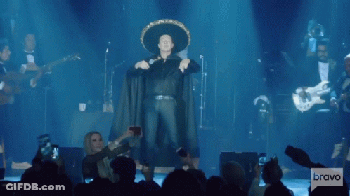Man In Sombrero Standing On Stage GIF