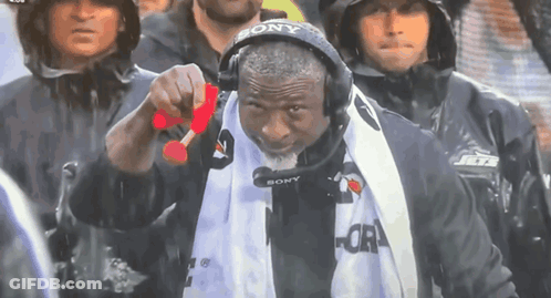 Man In Sony Headset Holding Red Object GIF