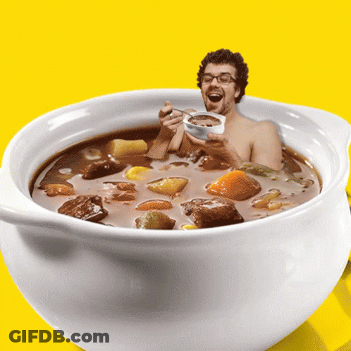 Man In Soup Bowl Holding Spoon GIF