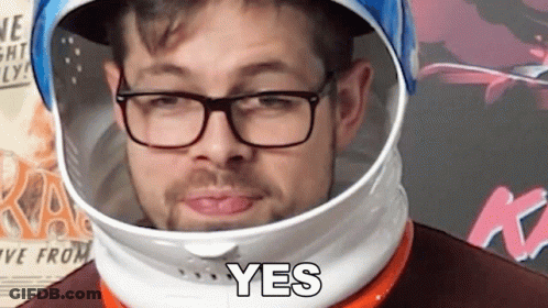 Man In Space Helmet And Glasses Says Yes GIF