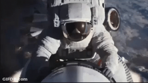 Man In Space Suit Riding Rocket GIF