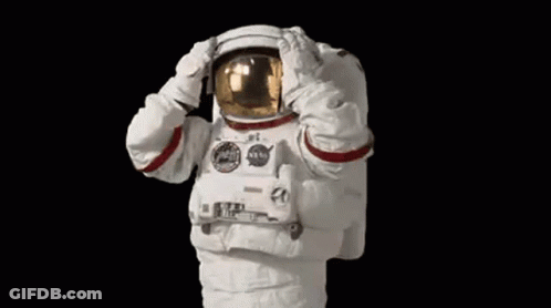 Man In Space Suit Saluting With Hands On Helmet GIF