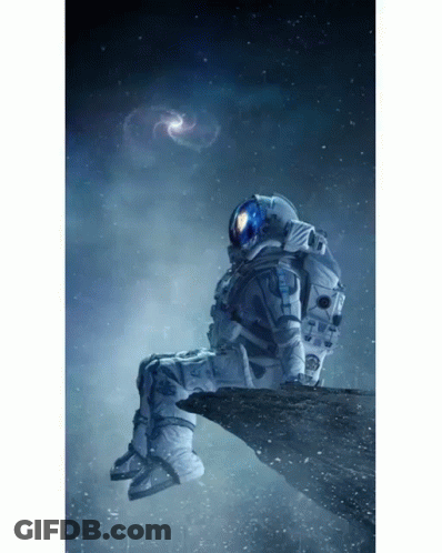 Man In Space Suit Sitting In Chair GIF