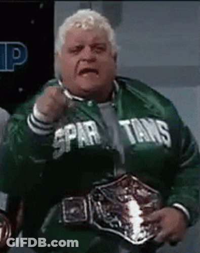 Man In Spartans Jacket Holding Wrestling Belt GIF