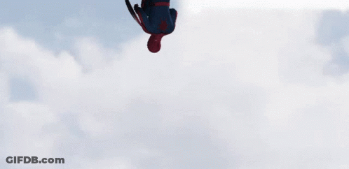 Man In Spider Man Costume Holding Captain America Shield GIF