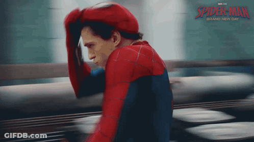 Man In Spider-Man Costume Holding Hand To Head GIF