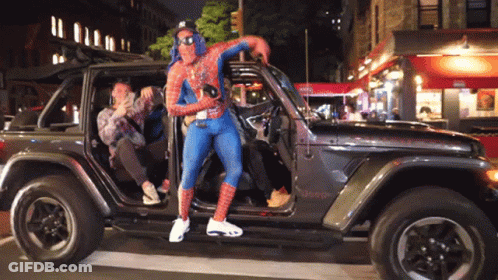 Man In Spider-Man Costume Standing In Jeep GIF