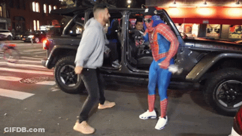 Man In Spiderman Costume Beside Jeep GIF