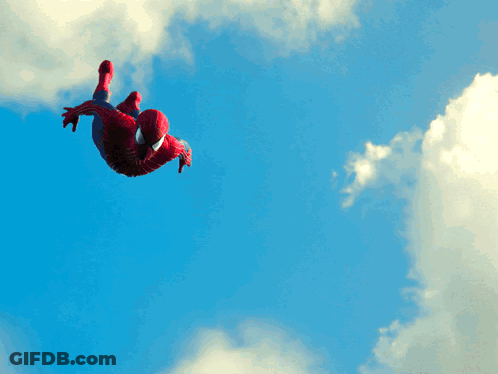 Man In Spiderman Costume Flying Through Air GIF