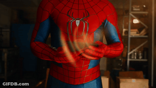 Man In Spiderman Costume Holding Something GIF