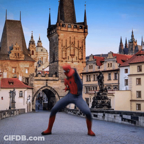 Man In Spiderman Costume On Bridge Near Castle GIF