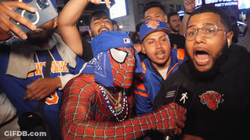 Man In Spiderman Costume Poses GIF