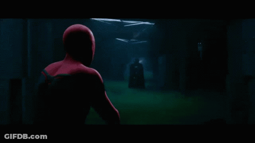 Man In Spiderman Costume Standing In Front Of Lockers GIF