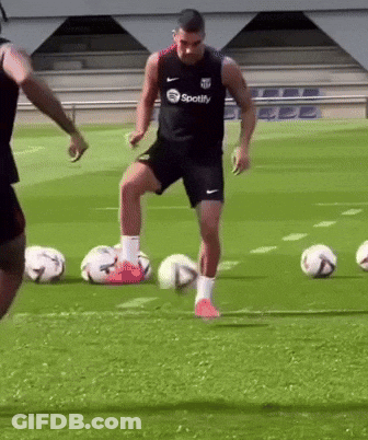 Man In Spotify Shirt Kicking Soccer Ball GIF
