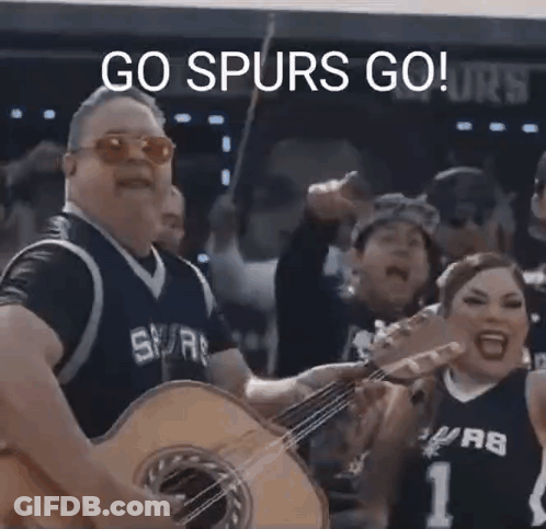 Man In Spurs Jersey Playing Guitar GIF