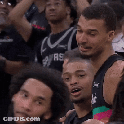 Man In Spurs Jersey Sitting In Crowd GIF