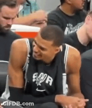 Man In Spurs Jersey Sitting In Stadium GIF
